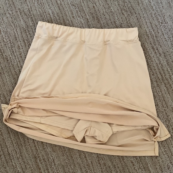 Golden Skorts. Slits on sides. Size Medium. 100% Polyester. Made in China. - Picture 2 of 3